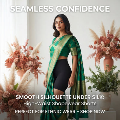 A South Asian woman in a silk saree with a smooth silhouette, demonstrating the effect of high-waist tummy control shapewear.